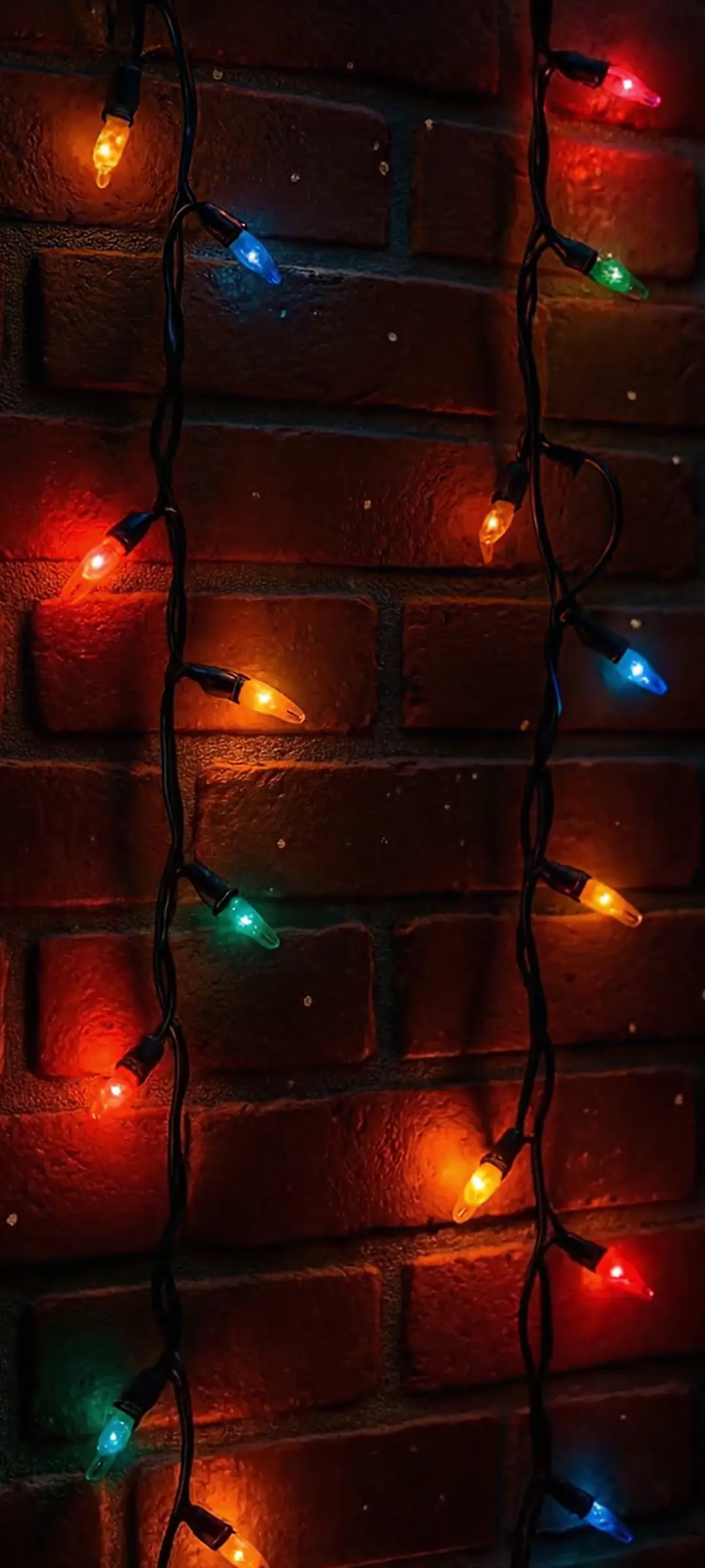 Festive Christmas Lights on Brick Wall