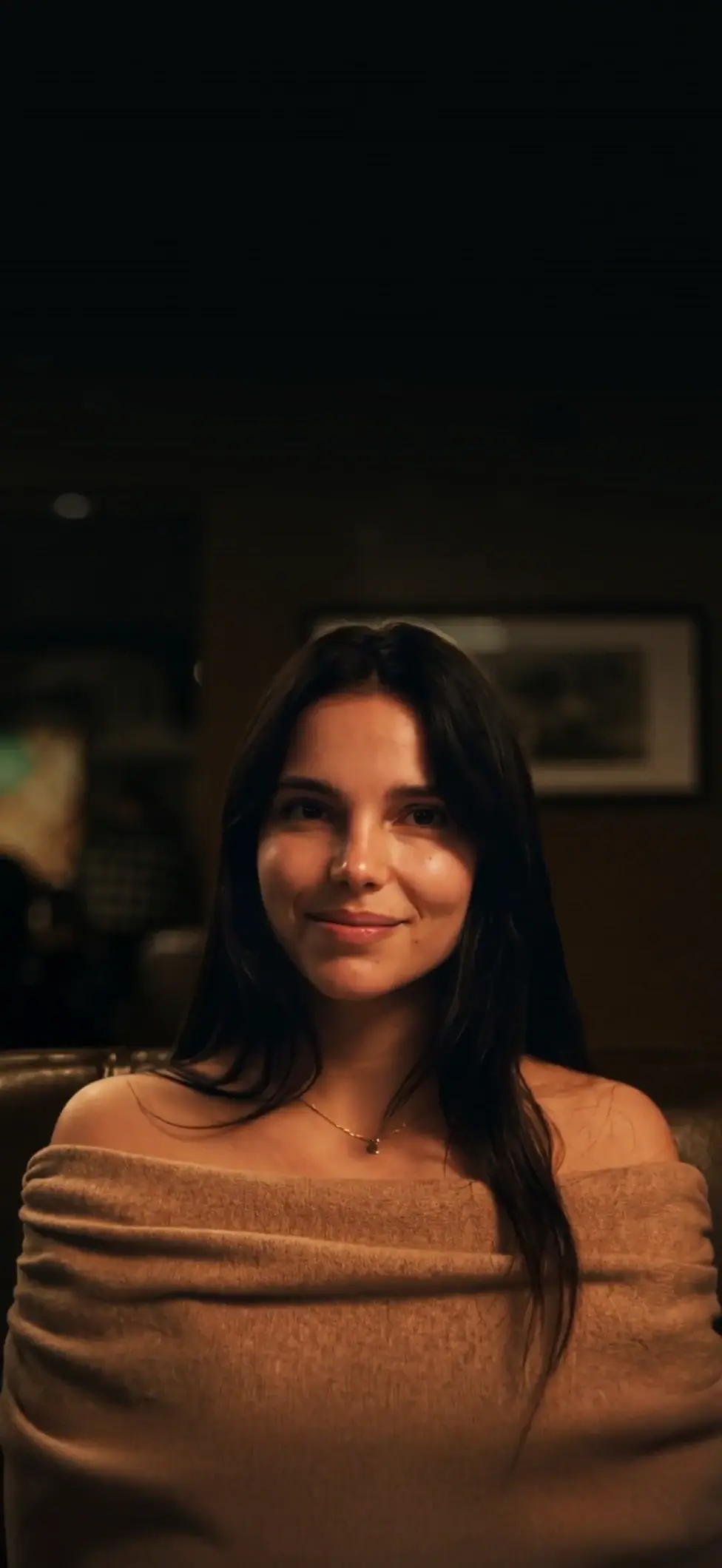 Aesthetic Portrait of Smiling Woman in Cozy Setting